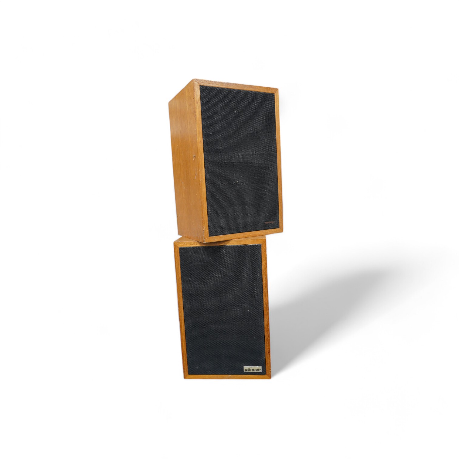 A pair of Audiomaster LS3/5A monitor speakers made under license from the BBC, in teak veneer cabinets, 30.5cm high, 19cm wide, 16.5cm deep. Condition - fair to good, one label missing to front